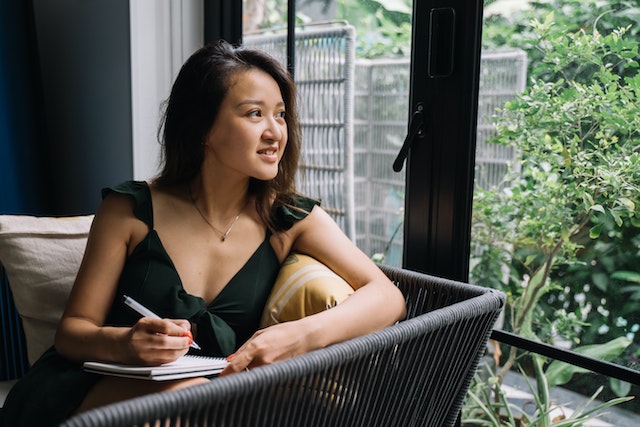 happy card lottery winner looking out window