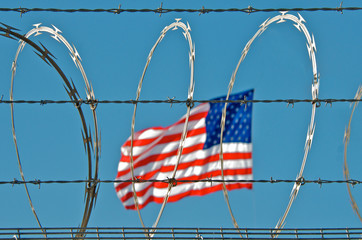 american flag and barbed wire
