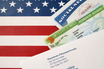 green card and american flag and other documents