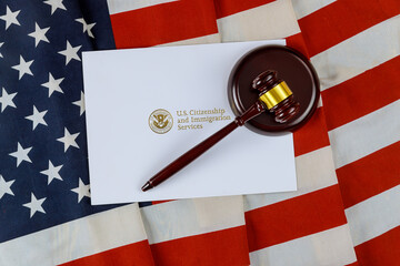 gavel american flag and uscis paper