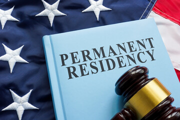 american flag with gavel and permanent residency book