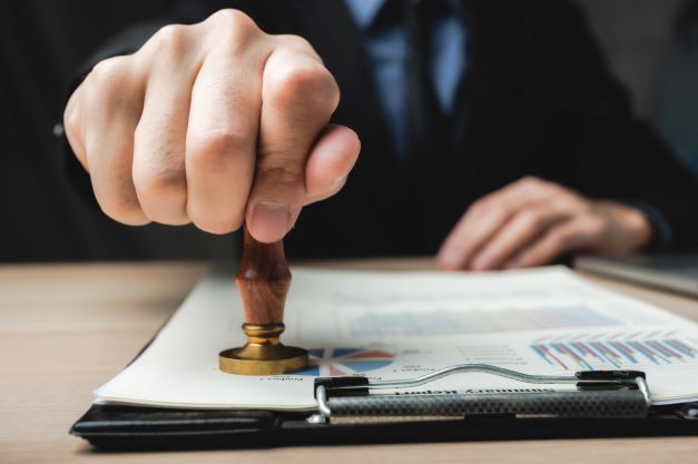 judge stamping paper