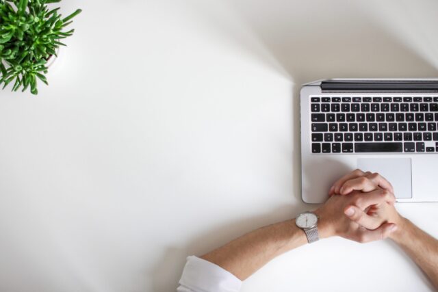 hands and a laptop