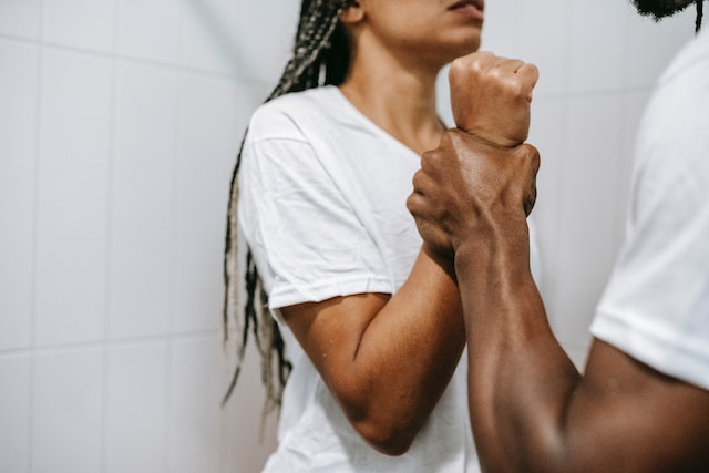 man holding woman's wrist