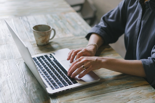 woman typing to get visa
