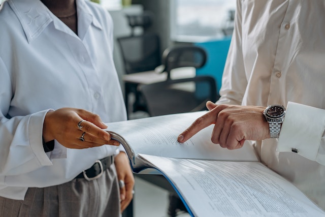 man pointing to visa eligibility document