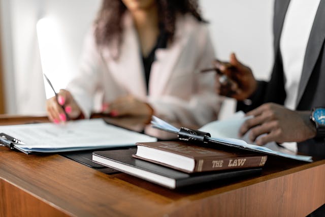 man and woman reading legal document