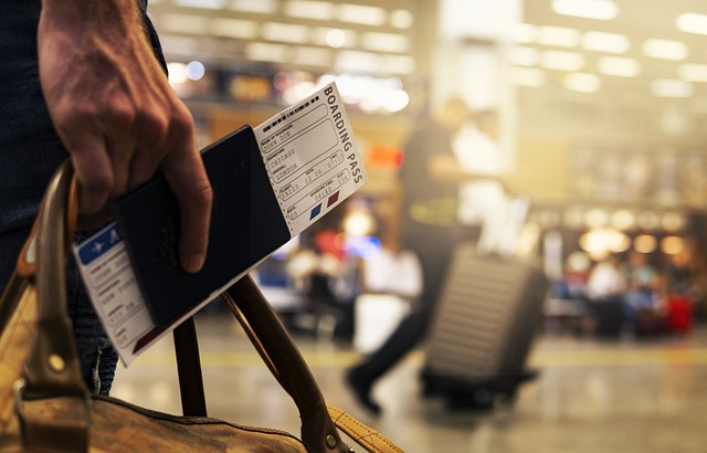 person holding passport in airport