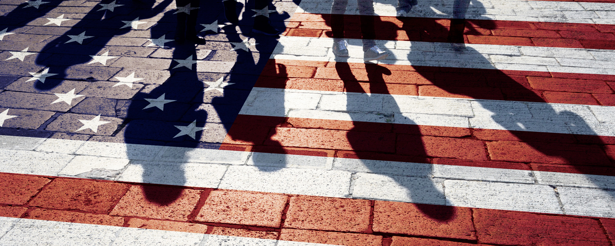 Group of people walking with painted usa flag