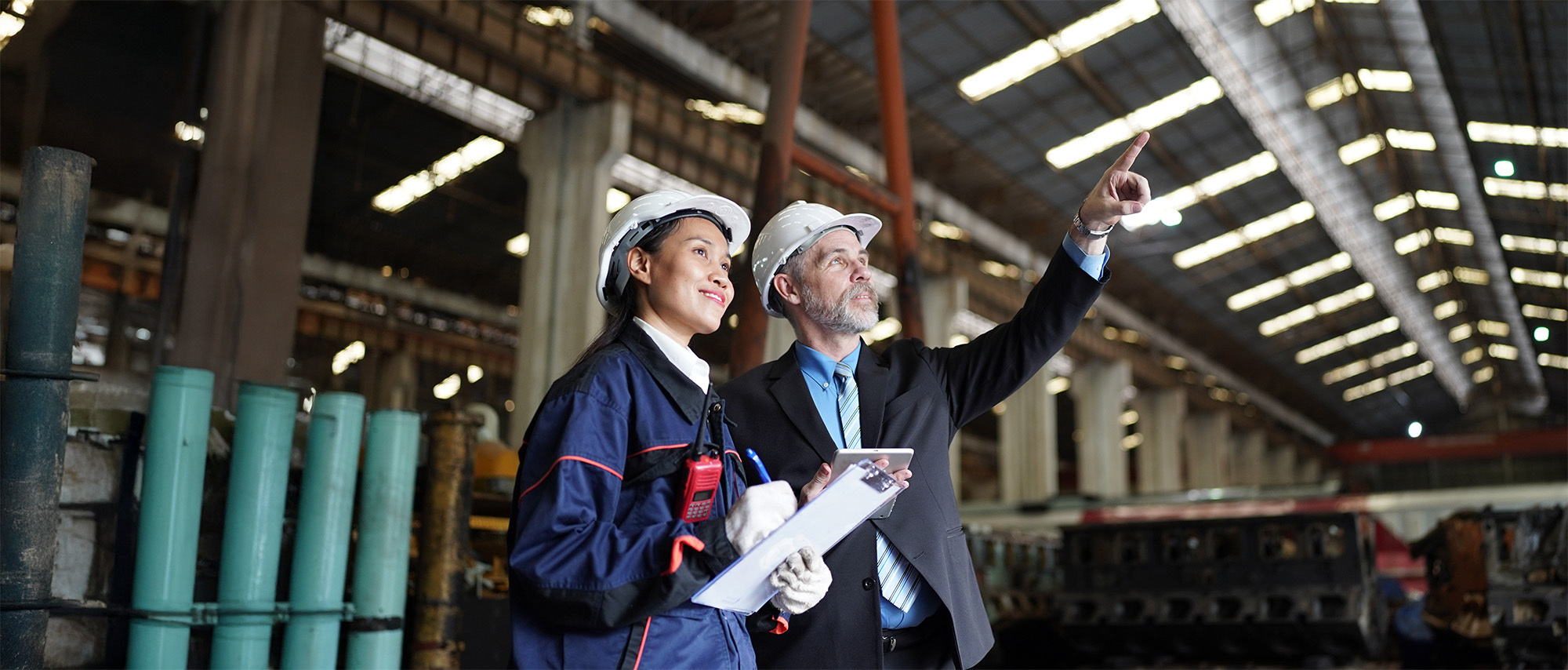 actory manager or businessman and female engineer in factory