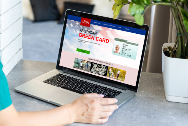 computer screen with green card application